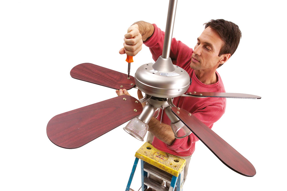 Man fixing a ceiling fan
