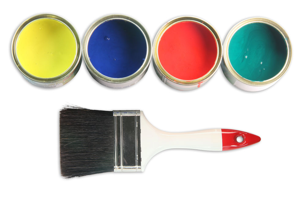 Paint tins and paintbrush