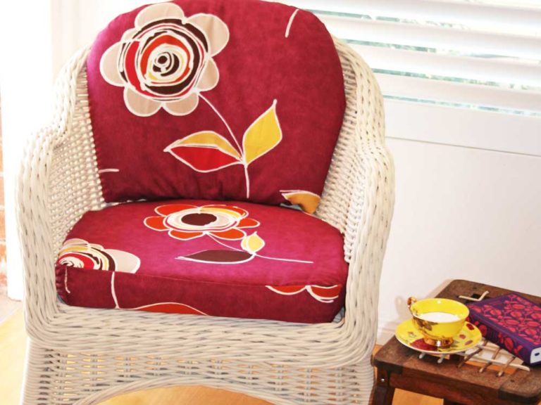 Upcycle A Wicker Chair With Spray Paint And Cushion Covers