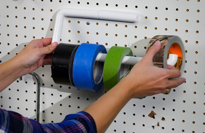 Paper towel holder tape storage