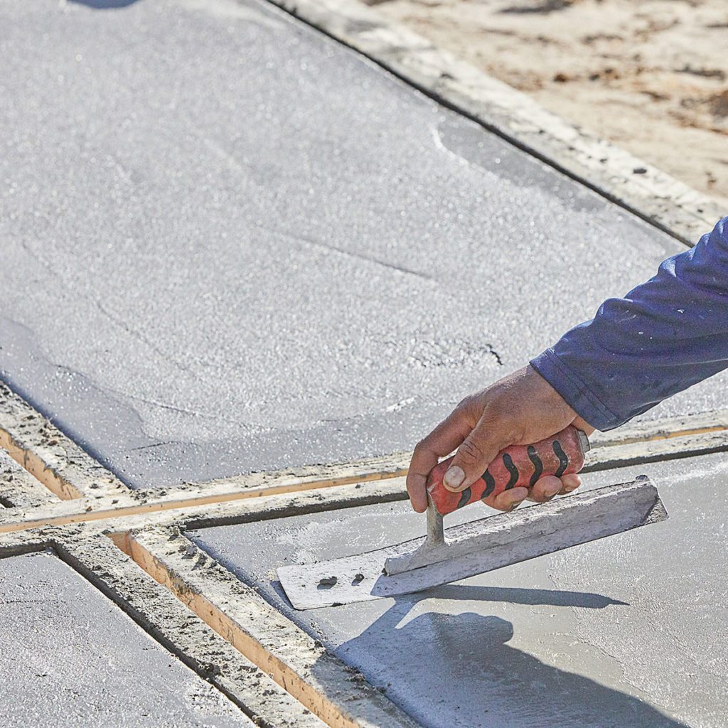 Step 11: Trowel the concrete