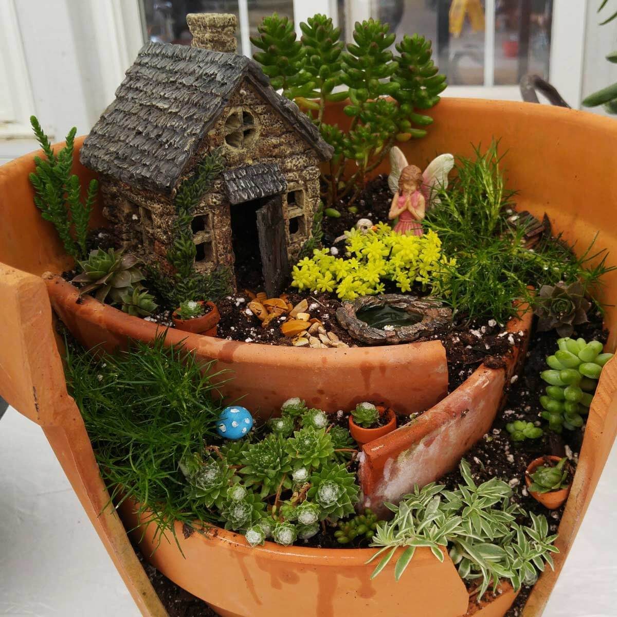 Broken pot fairy garden