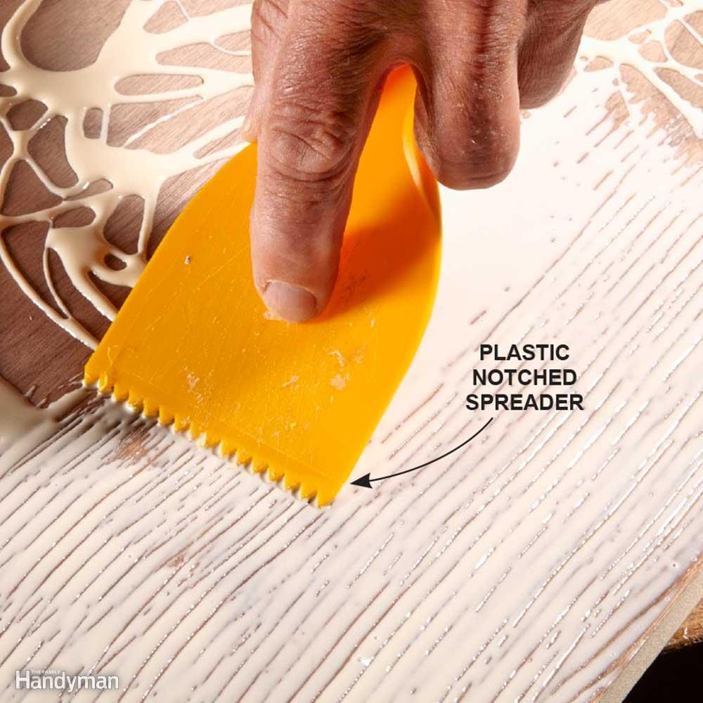 Spread glue with a notched trowel