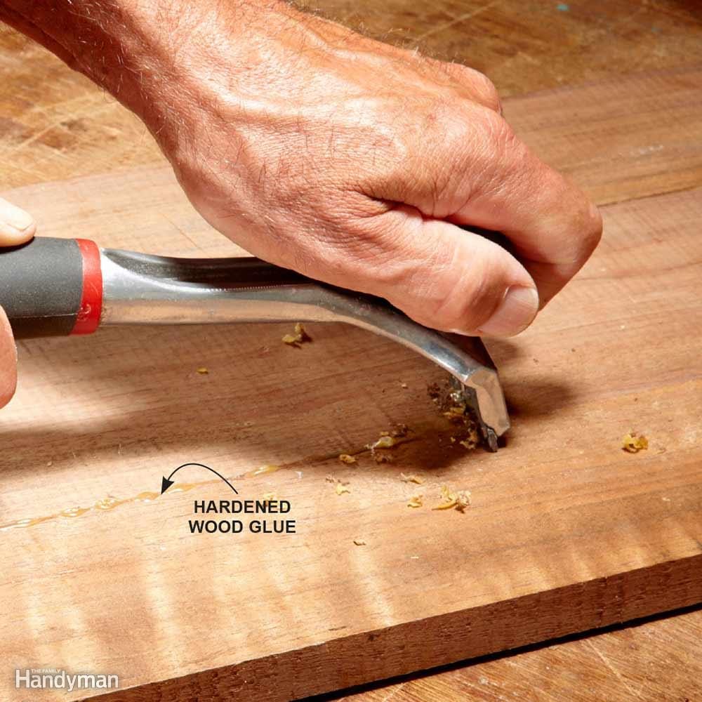 Remove hardened glue with a paint scraper