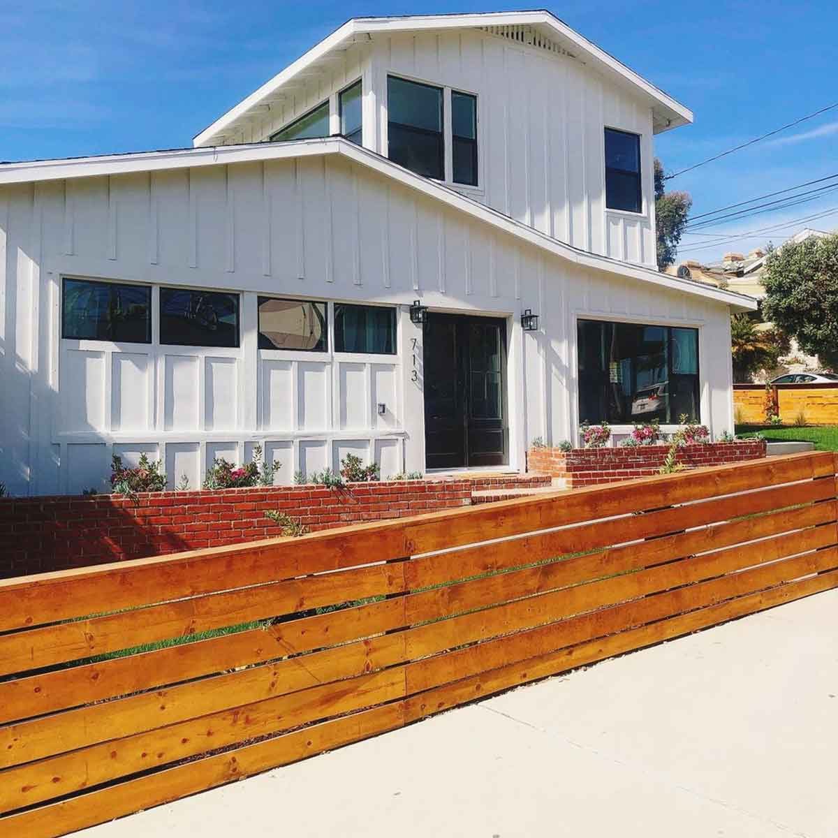 Horizontal wood-slat front yard fence