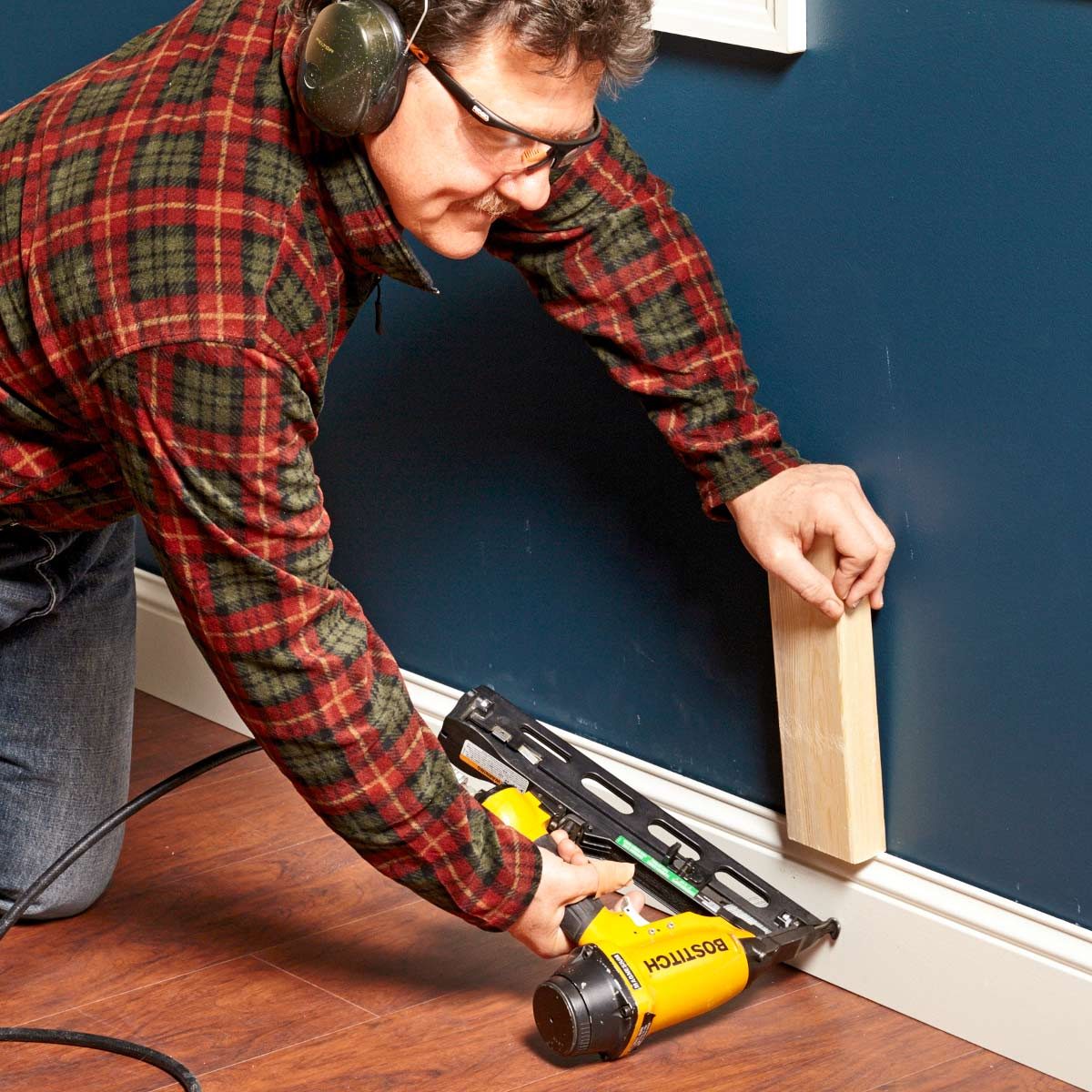 Use a block to push skirting board