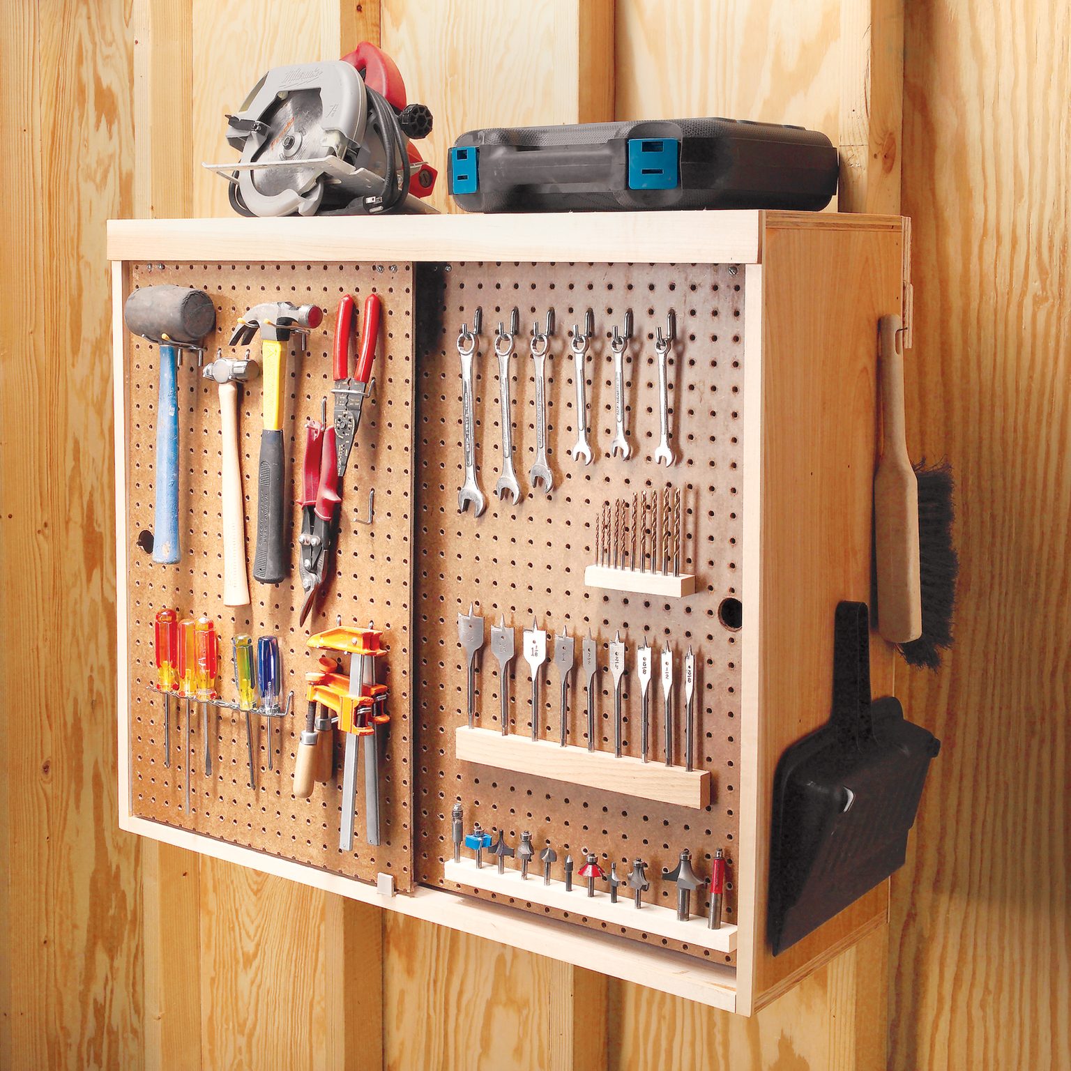 Cabinet with pegboard bypass doors