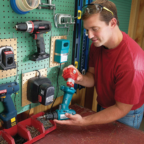 a man charging tools 
