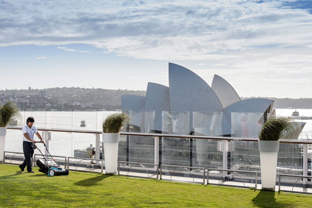 Celebrity Solstice Lawn Club, man mowing grass in front of opera house, Handyman magazine, 