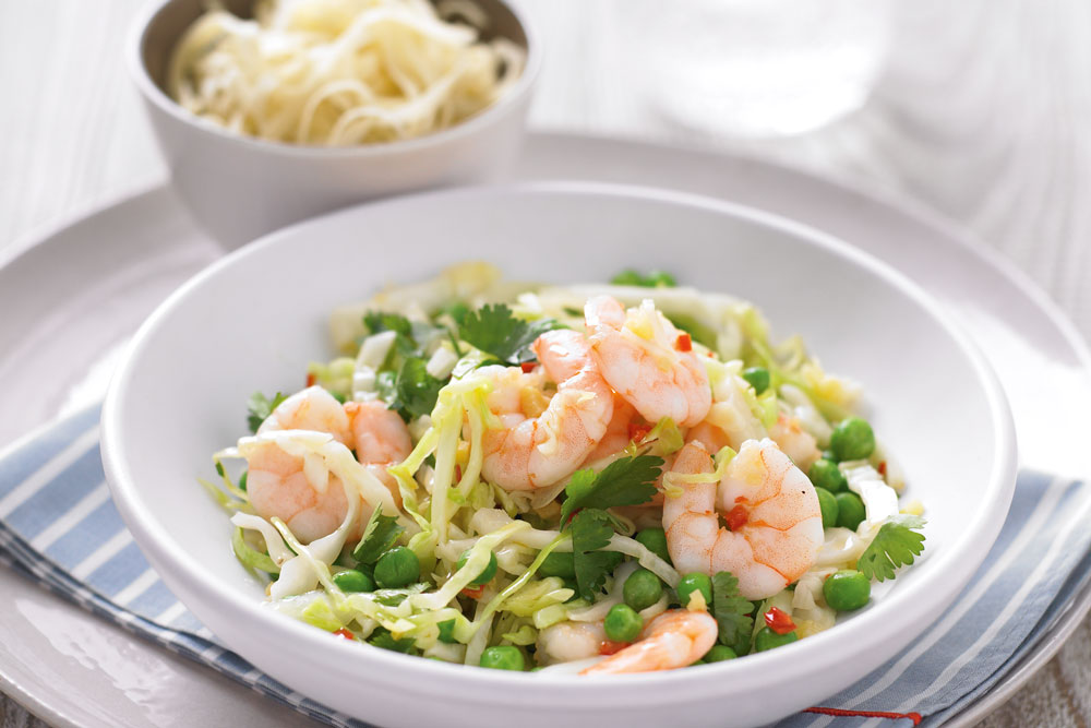 Chilli, prawn and pea stir-fry in a bowl