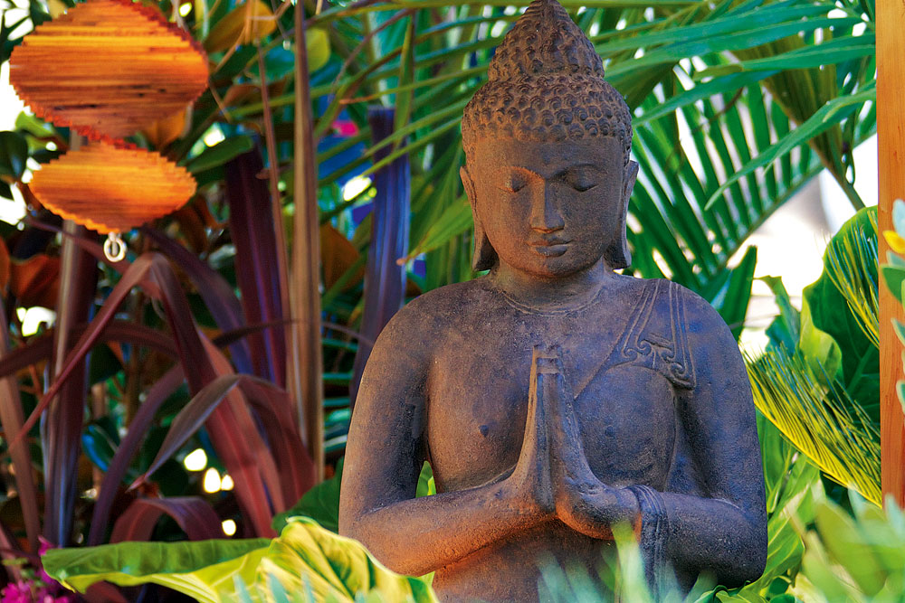 buddha in tropical garden, handyman magazine, 
