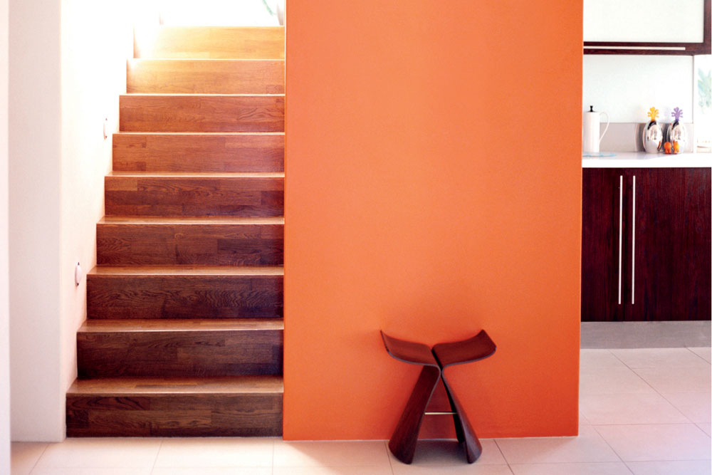 orange wall next to staircase, 
