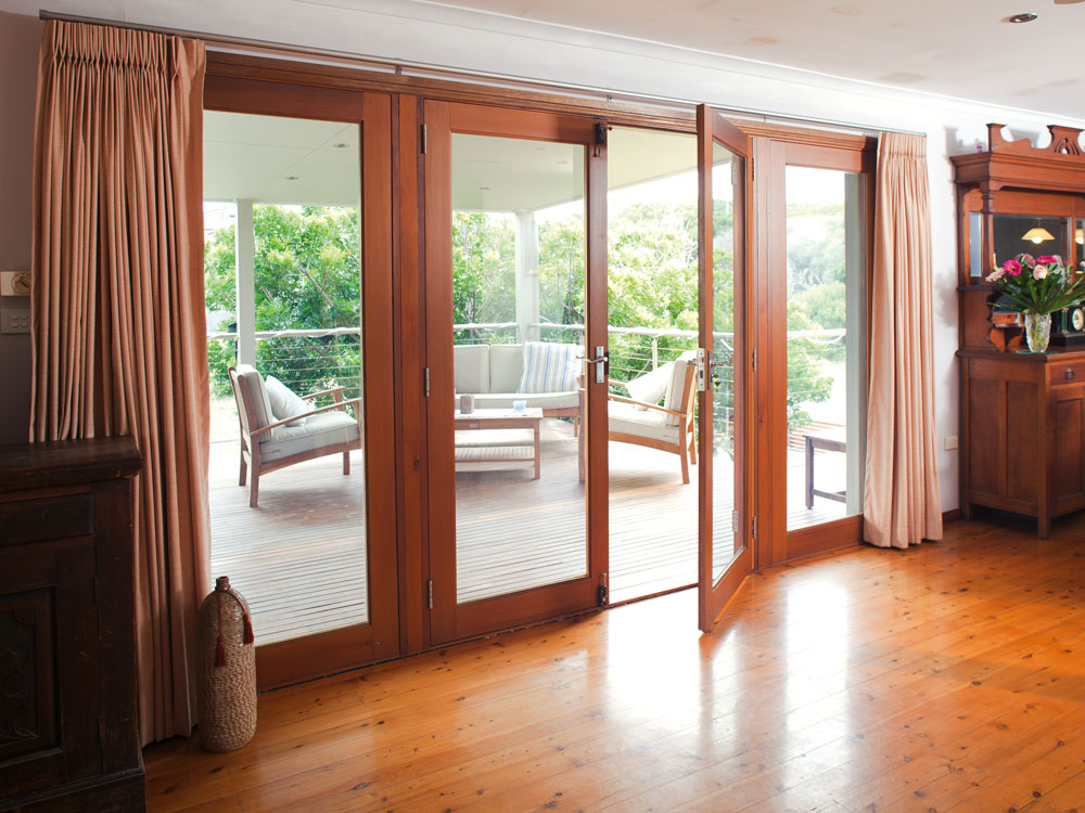 After: French doors flood the interior with light and integrate the deck with the floorplan.