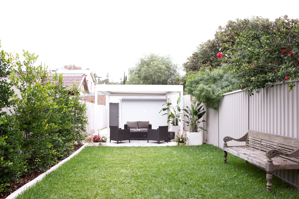 Rear lane access leads to off-street  parking that doubles as an outdoor  living area, adding value to the property.